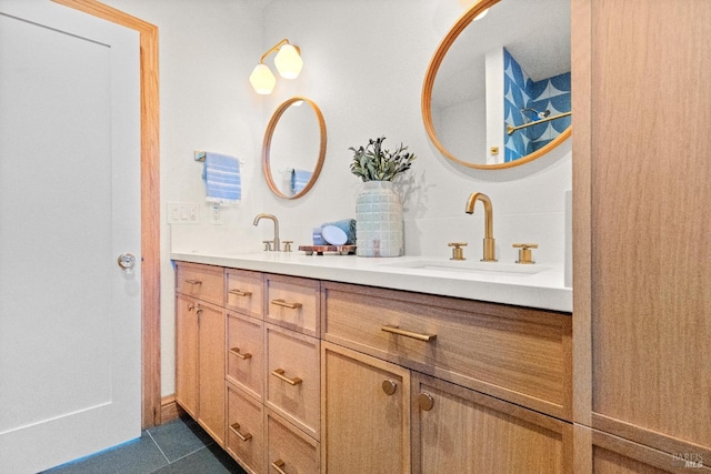 bathroom with tile patterned flooring and vanity