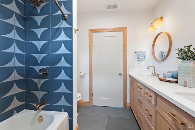 full bathroom with tile patterned floors, vanity, toilet, and tub / shower combination