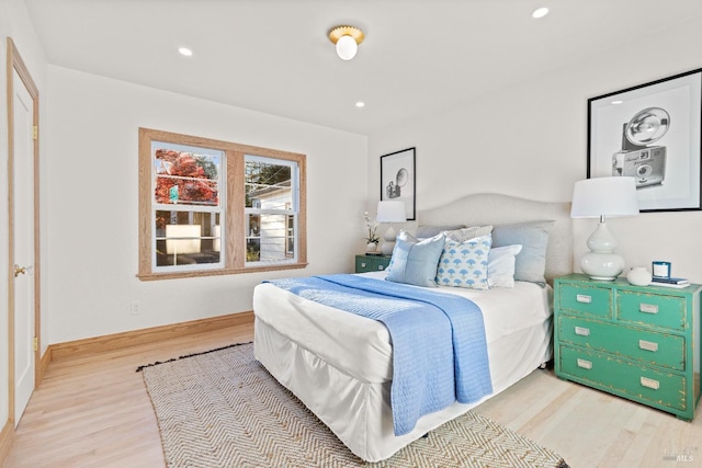 bedroom with light hardwood / wood-style flooring