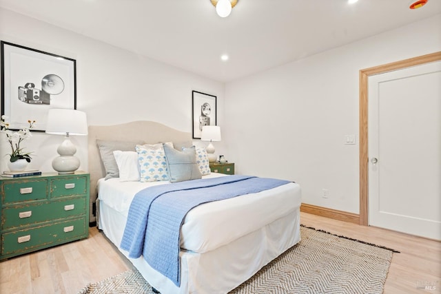 bedroom with light hardwood / wood-style floors