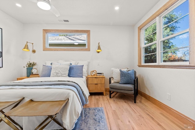 bedroom featuring ceiling fan and light hardwood / wood-style flooring