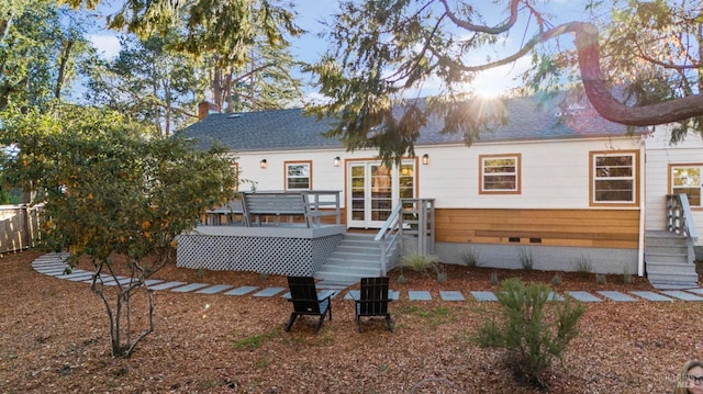 back of property featuring a wooden deck