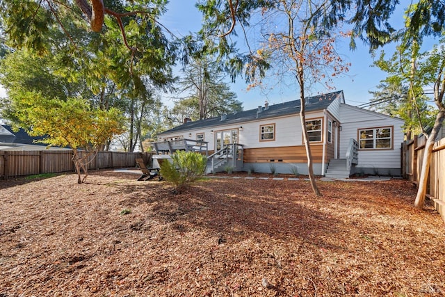 back of house featuring a deck