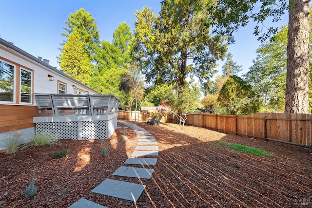 view of yard with a wooden deck