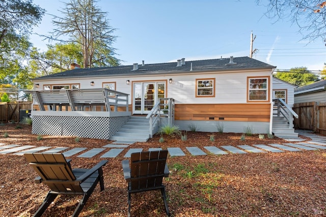 rear view of house with a wooden deck