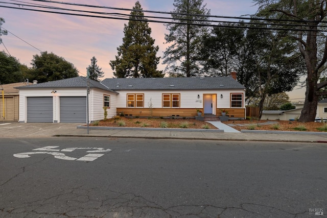 single story home featuring a garage