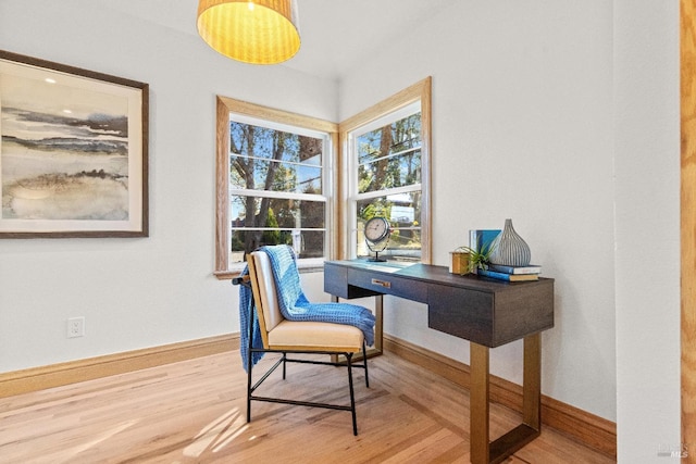 home office with hardwood / wood-style floors