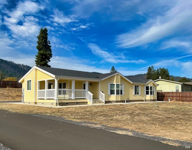 ranch-style home with a porch