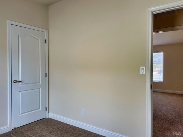 empty room featuring carpet flooring