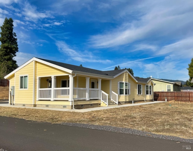 single story home with covered porch