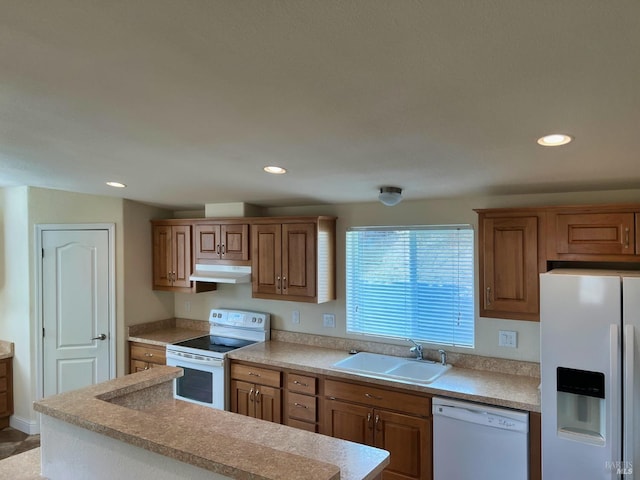 kitchen with sink and white appliances