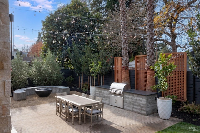 view of patio featuring area for grilling and a grill