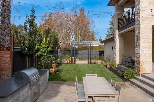 view of patio featuring area for grilling, a grill, a balcony, and a pergola