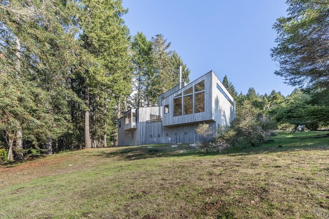 exterior space with a garage and an outdoor structure