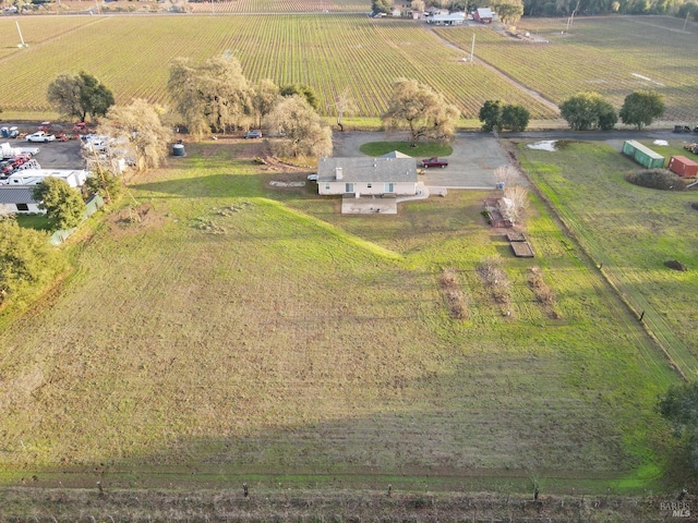 birds eye view of property featuring a rural view