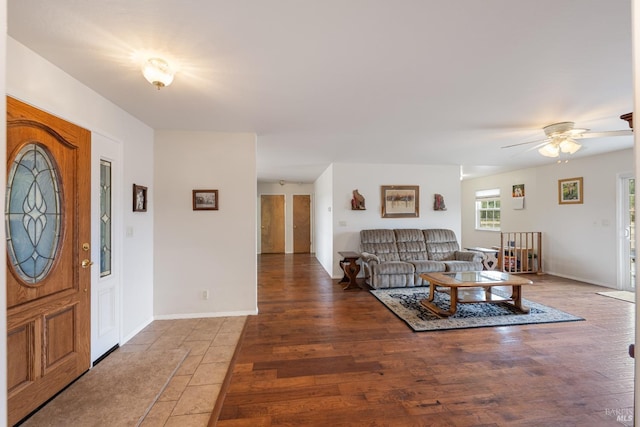 entryway with ceiling fan and hardwood / wood-style floors