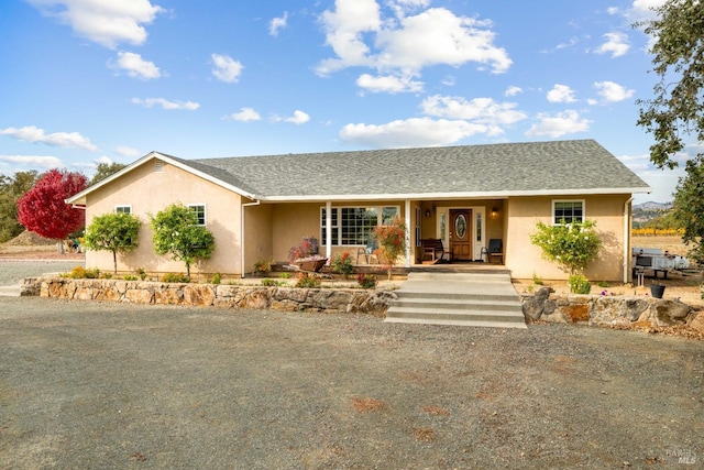 single story home featuring a porch