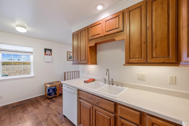 kitchen featuring wood-type flooring, white dishwasher, and sink