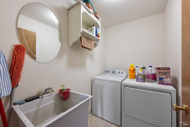 laundry room featuring sink and washing machine and clothes dryer