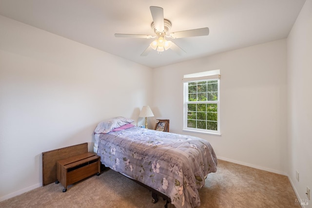 bedroom with light colored carpet and ceiling fan