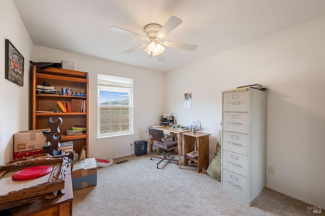 office with ceiling fan and light carpet