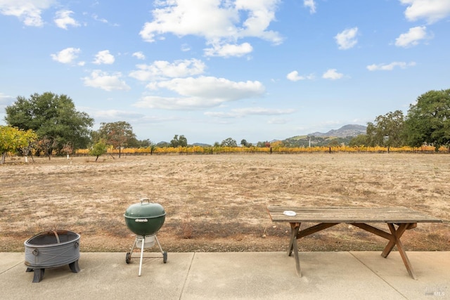 view of home's community featuring a mountain view and a fire pit