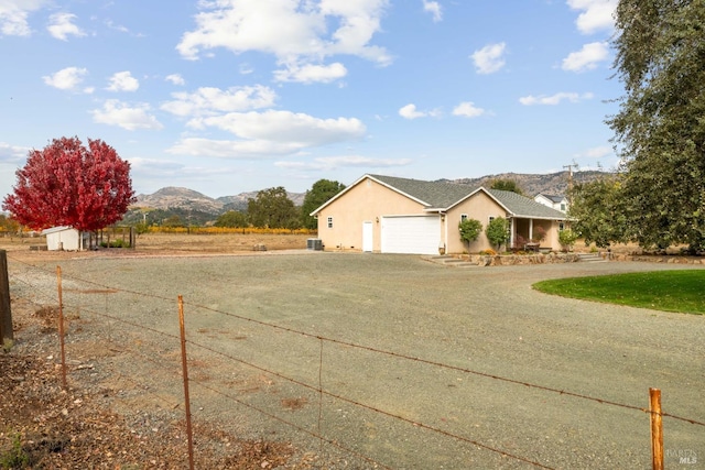 exterior space with a mountain view and a garage