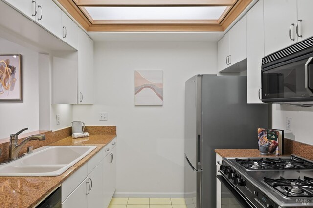 600 Deer Valley Rd Unit 1B, San Rafael, CA 94903 - kitchen featuring black appliances, a sink, white cabinets, baseboards, and light tile patterned floors