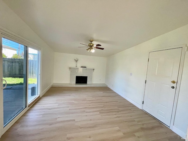 unfurnished living room with light hardwood / wood-style floors and ceiling fan