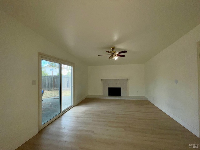 unfurnished living room featuring ceiling fan and light hardwood / wood-style flooring