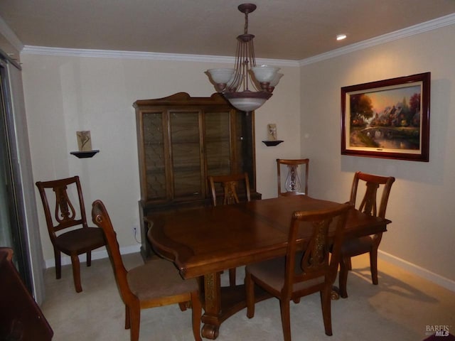 dining space with crown molding and light carpet