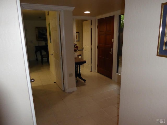 hall featuring light tile patterned floors