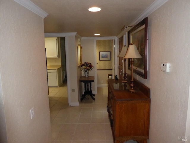 corridor featuring tile patterned flooring and ornamental molding