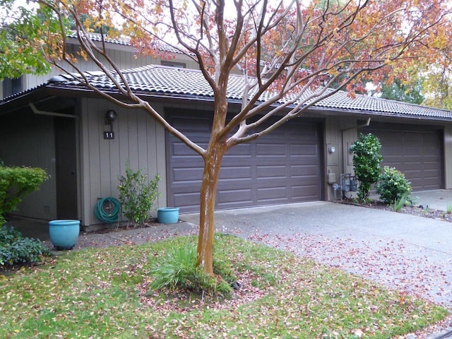 view of side of home with a garage