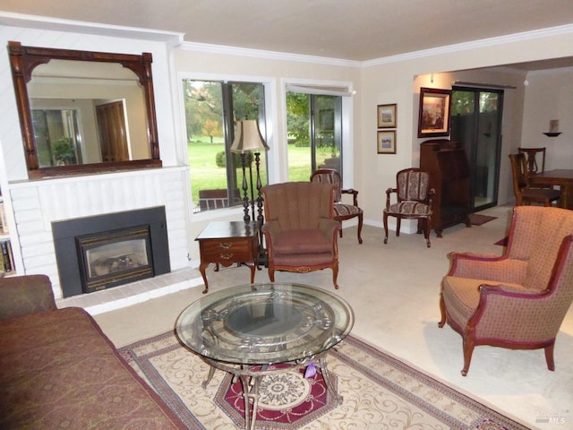 carpeted living room with crown molding and a brick fireplace