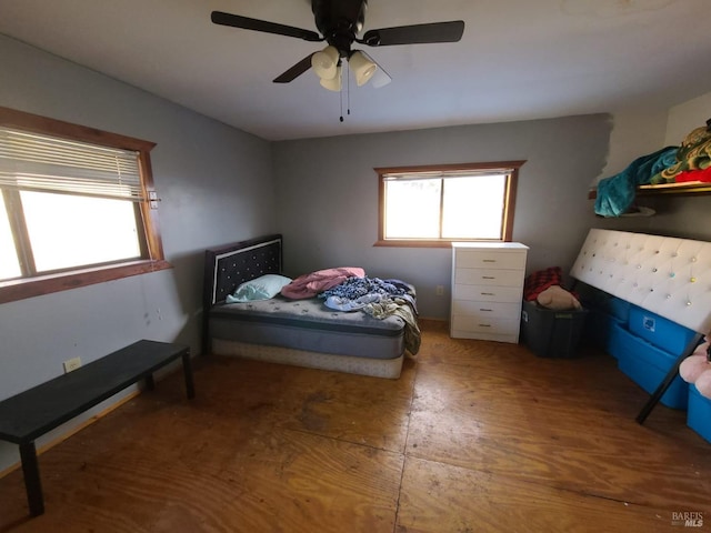 bedroom with hardwood / wood-style flooring and ceiling fan