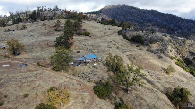 drone / aerial view with a mountain view and a rural view