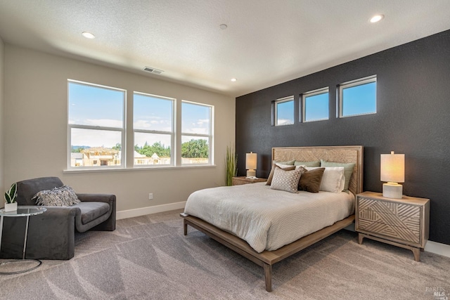 bedroom featuring carpet floors, visible vents, baseboards, and recessed lighting