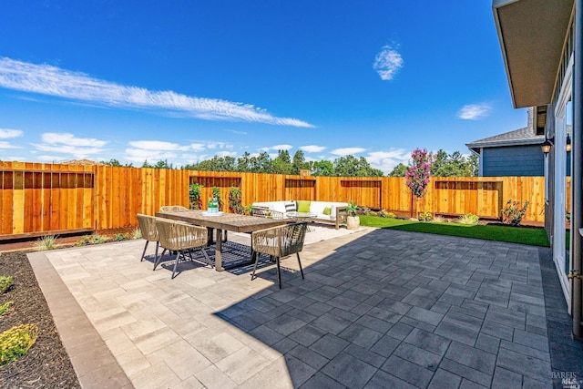 view of patio with a fenced backyard and outdoor lounge area