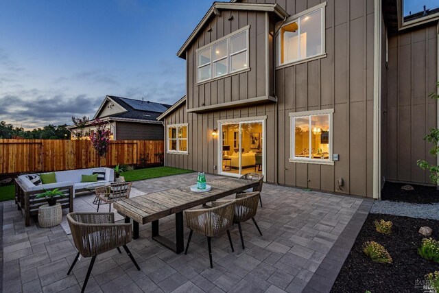 patio terrace at dusk with an outdoor hangout area