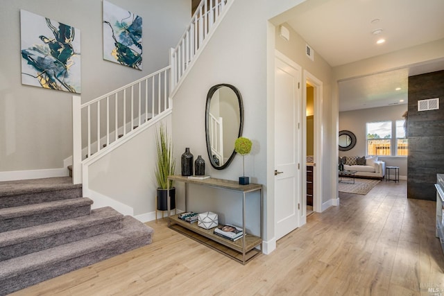 stairway featuring hardwood / wood-style floors