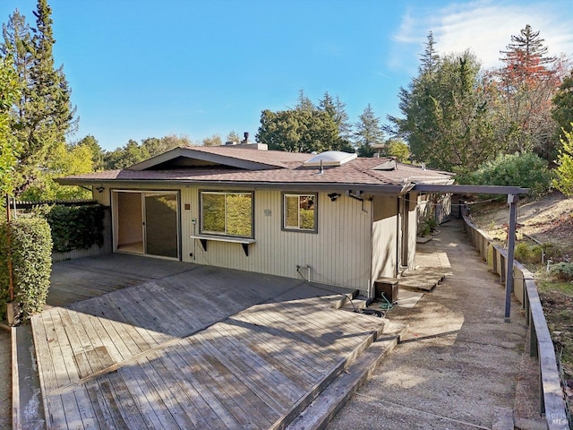 back of house with a wooden deck