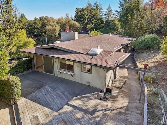 back of property featuring a deck