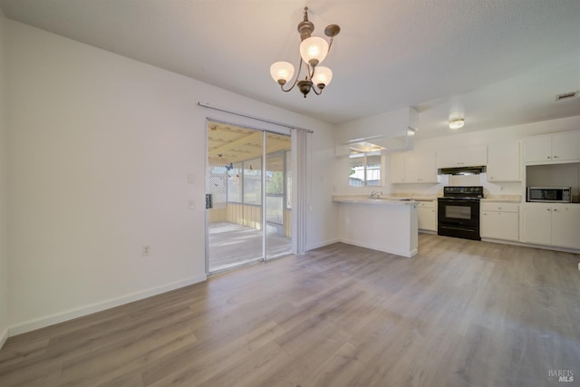 kitchen with white cabinetry, a chandelier, hanging light fixtures, light hardwood / wood-style flooring, and black / electric stove