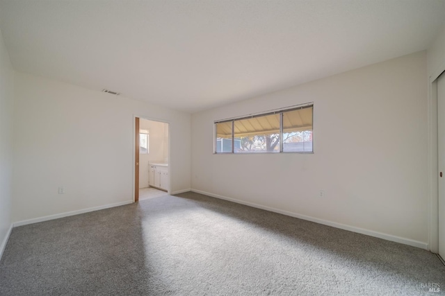 spare room with carpet floors and a healthy amount of sunlight