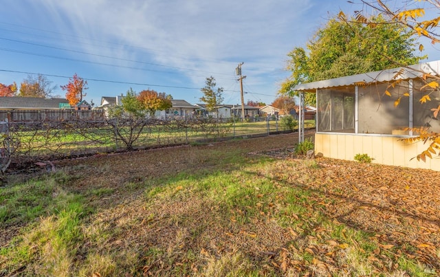 view of yard featuring a sunroom