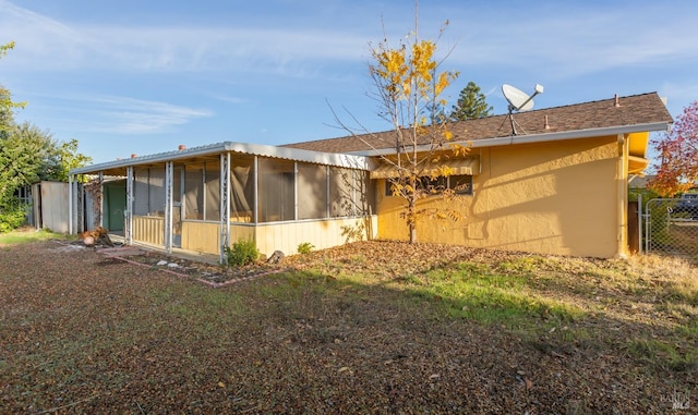 back of house with a sunroom