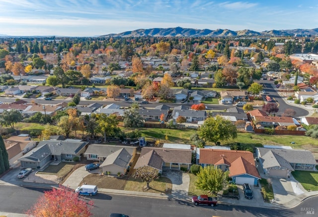 birds eye view of property with a mountain view