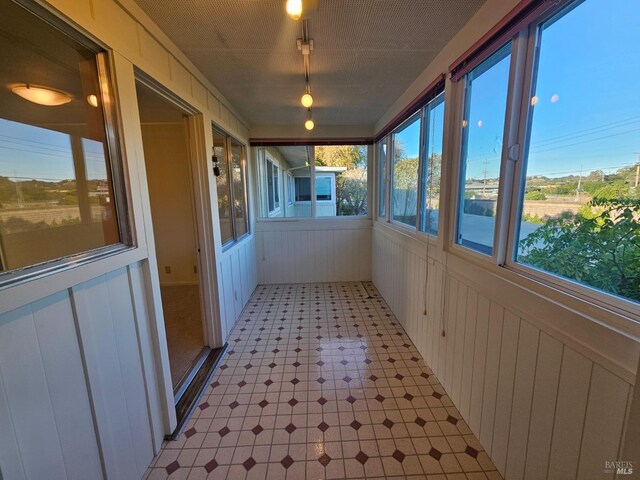 1056 Los Gamos Rd Unit C, San Rafael, CA 94903 - unfurnished sunroom with tile patterned floors and wood walls