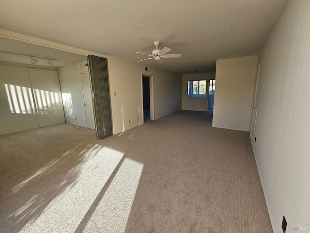 carpeted empty room with ceiling fan